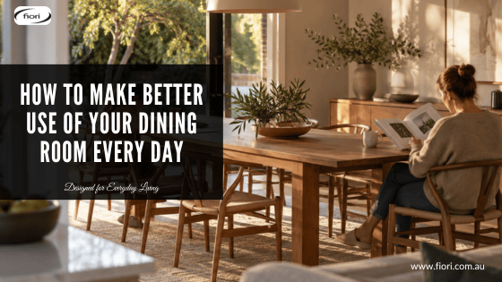 Australian dining room in soft late-afternoon light with an adult reading at one end of a timber table while a child draws quietly at the other.