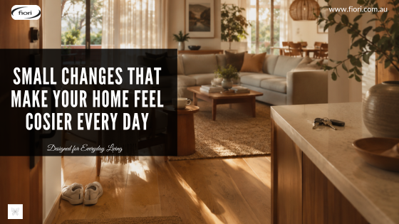 Warm contemporary Australian living room with layered lighting, natural textures and lived-in styling creating a calm, welcoming atmosphere.