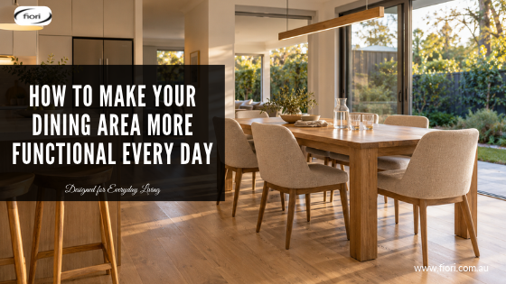 Contemporary Australian dining area with a timber table, comfortable upholstered chairs and a clear walkway connecting the kitchen and dining space.